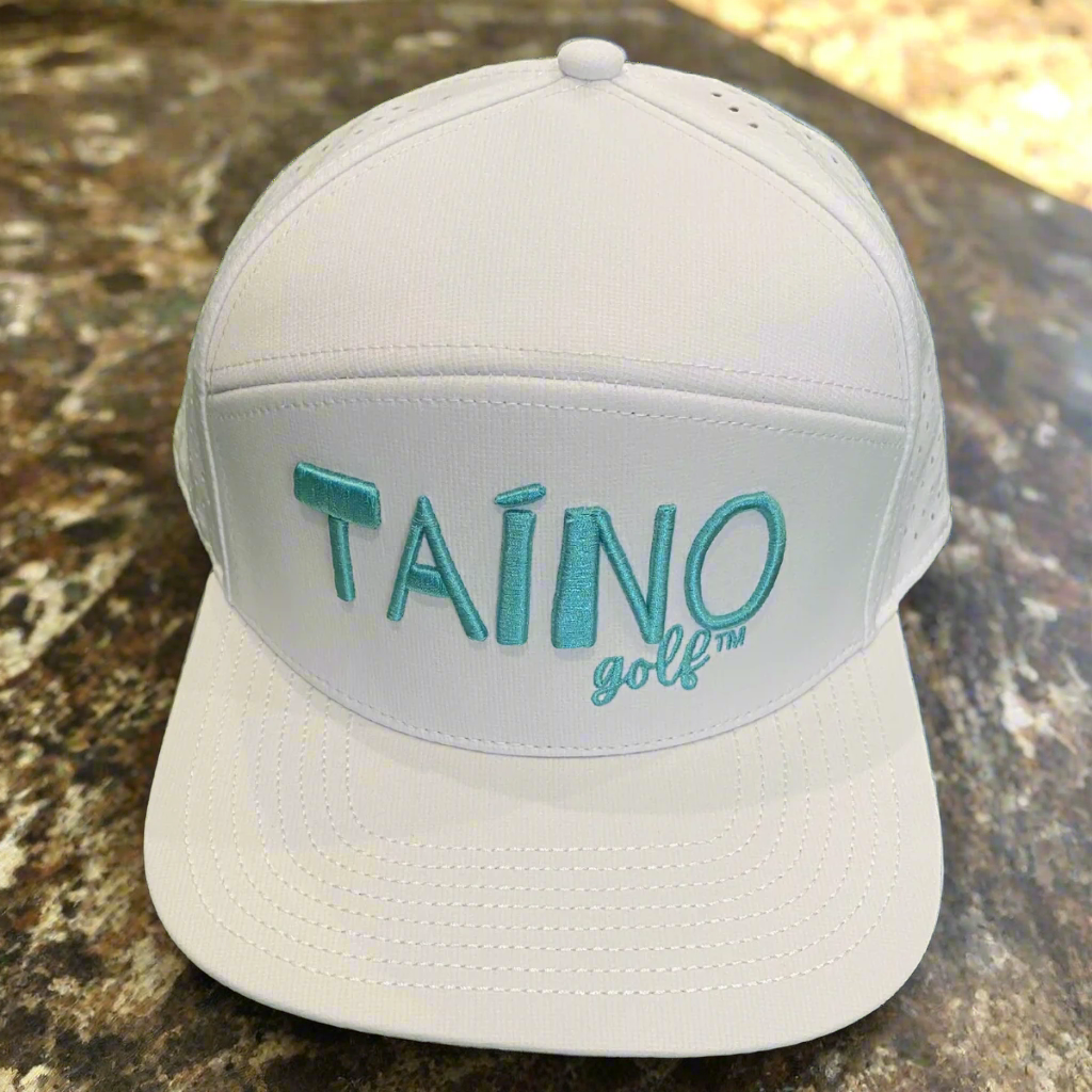 Waterproof Taino Golf hat in white, designed to protect golfers from sun and rain while maintaining breathability and comfort, featuring the Taino Golf logo in teal on the front.